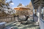 Upper deck with outdoor dining, umbrella, barbecue, beautiful views